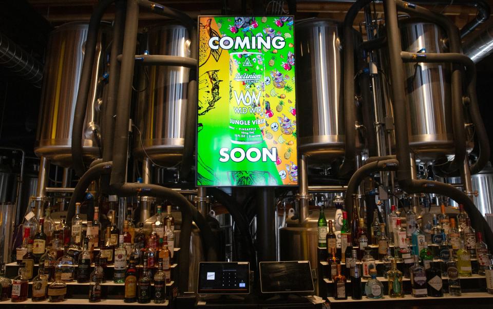 A sign announcing the coming of ReUnion Brewery and WLD WTR's new THC beverage is pictured above the bar Monday, Jan. 22, 2024 at ReUnion's downtown Iowa City, Iowa, location.