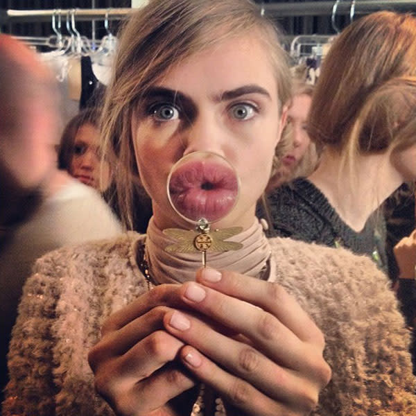 Cara Delevingne shared this snap of her backstage at NYFW, writing 'KISS ME!'