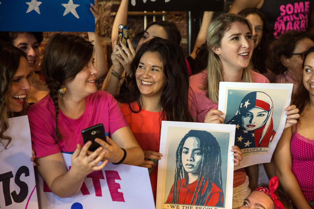  american expats and travellers gather with the international community in bangkok at the roadhouse bbq restaurant to stand in solidarity on january 21, 2017 in bangkok, thailand