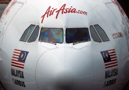 An AirAsia plane sits on the tarmac at Kuala Lumpur International Airport, Malaysia August 28, 2016. REUTERS/Edgar Su