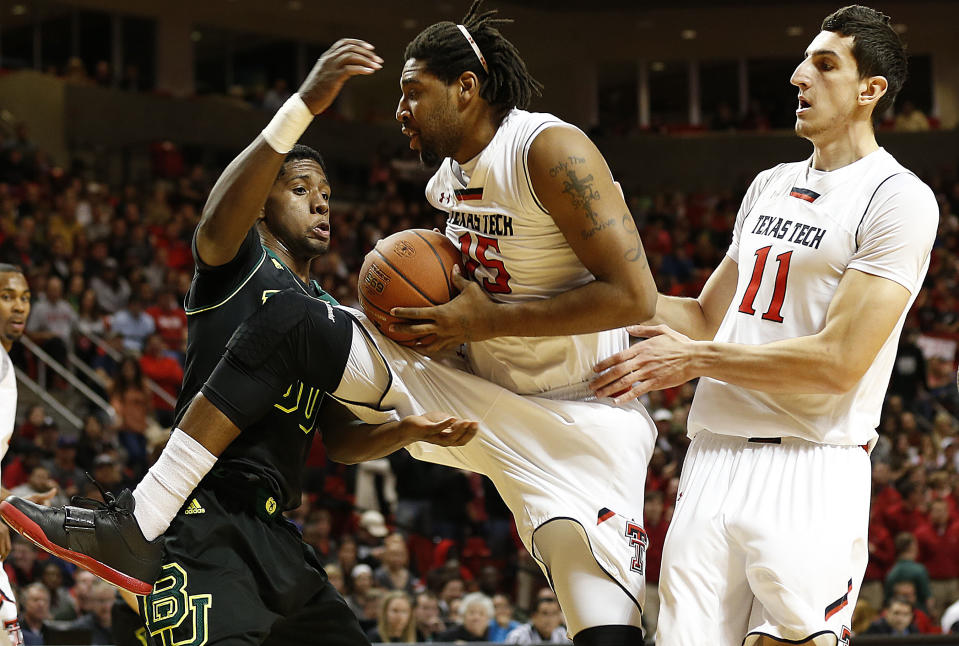 Texas Tech's Aaron Ross (15) grabs away a rebound from Baylor's Royce O'Neale as teammate Dejan Kravic(11) looks on during an NCAA college basketball game in Lubbock, Texas, Wednesday, Jan, 15, 2014. (AP Photo/Lubbock Avalanche-Journal, Tori Eichberger) ALL LOCAL TV OUT