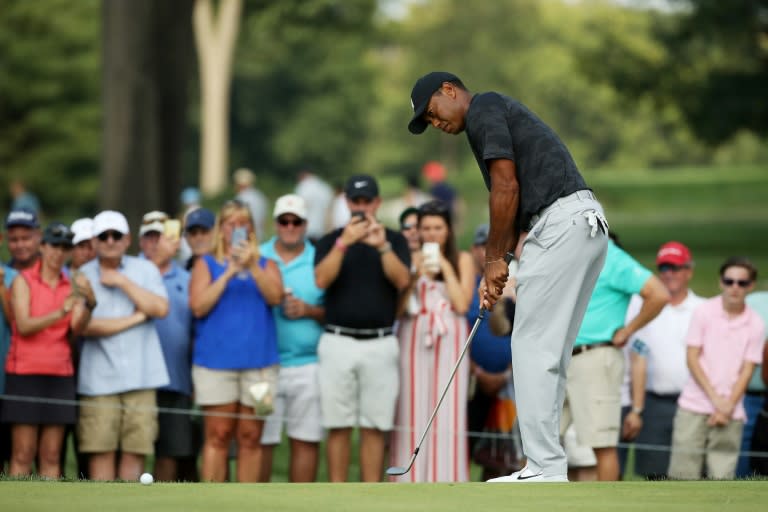 Tiger Woods faced a near hour anxious wait before confirmation his scores of a pair of 71s was good enough to make the cut at the Northern Trust