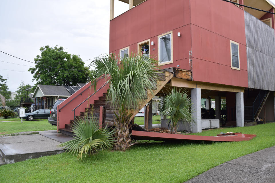 This bight-coloured house has seen its step wall collapse. Source: Australscope Photos