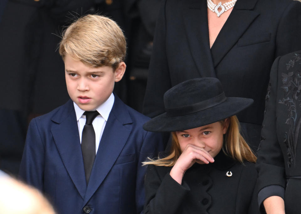 LONDON, ENGLAND - SEPTEMBER 19: Prince George of Wales and Princess Charlotte of Wales during the State Funeral of Queen Elizabeth II at Westminster Abbey on September 19, 2022 in London, England. Elizabeth Alexandra Mary Windsor was born in Bruton Street, Mayfair, London on 21 April 1926. She married Prince Philip in 1947 and ascended the throne of the United Kingdom and Commonwealth on 6 February 1952 after the death of her Father, King George VI. Queen Elizabeth II died at Balmoral Castle in Scotland on September 8, 2022, and is succeeded by her eldest son, King Charles III. (Photo by Karwai Tang/WireImage)