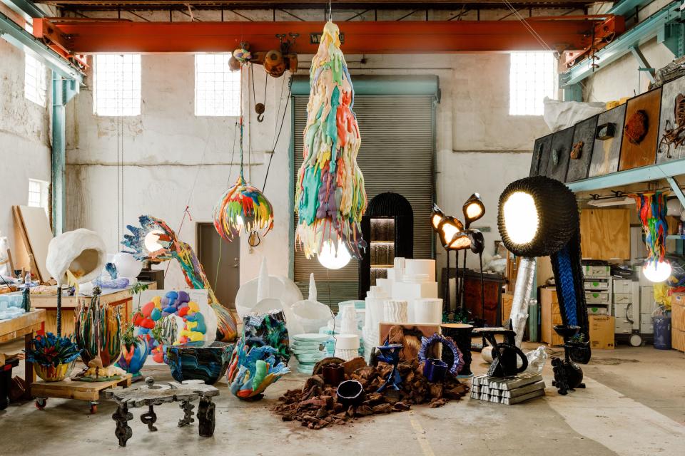 Monumental works such as the Blow Lamp (right), Swamp Drain chandelier (middle), and Swamp Pet chandelier (middle back), are now possible in Gander's soaring new studio space.