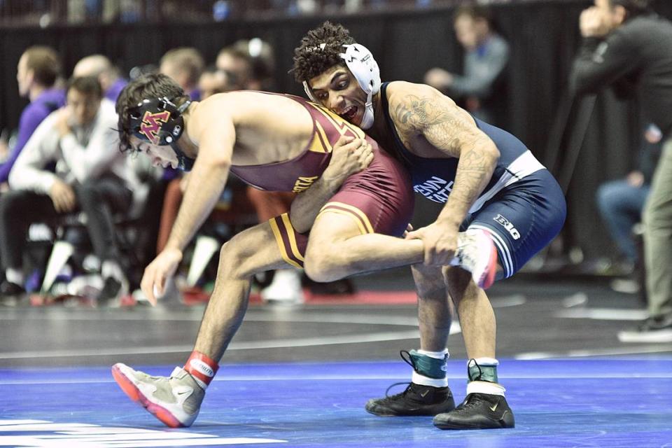 Penn State’s Roman Bravo-Young controls Minnesota’s Aaron Nagao in their 133-pound quarterfinals match of the NCAA Championships on Friday, March 17, 2023 at the BOK Center in Tulsa, Okla. Bravo-Young snuck by Nagao, 4-1.