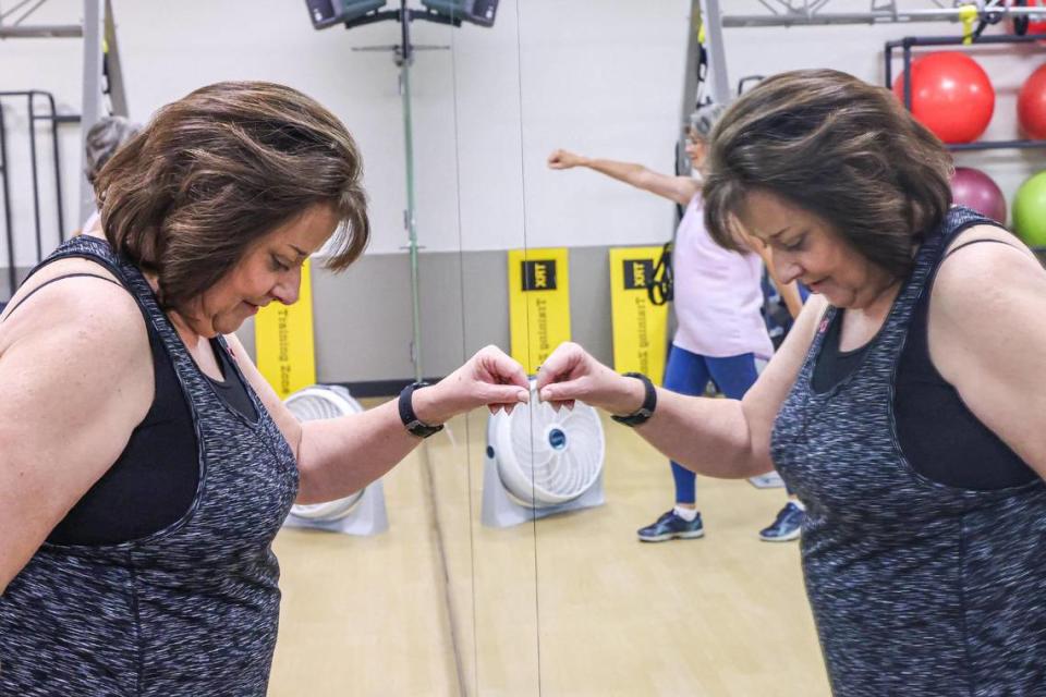 Mitzi Gault participates in a coordination exercise as part of her Nutrition Exercise and Attitude for Tomorrow exercise program.