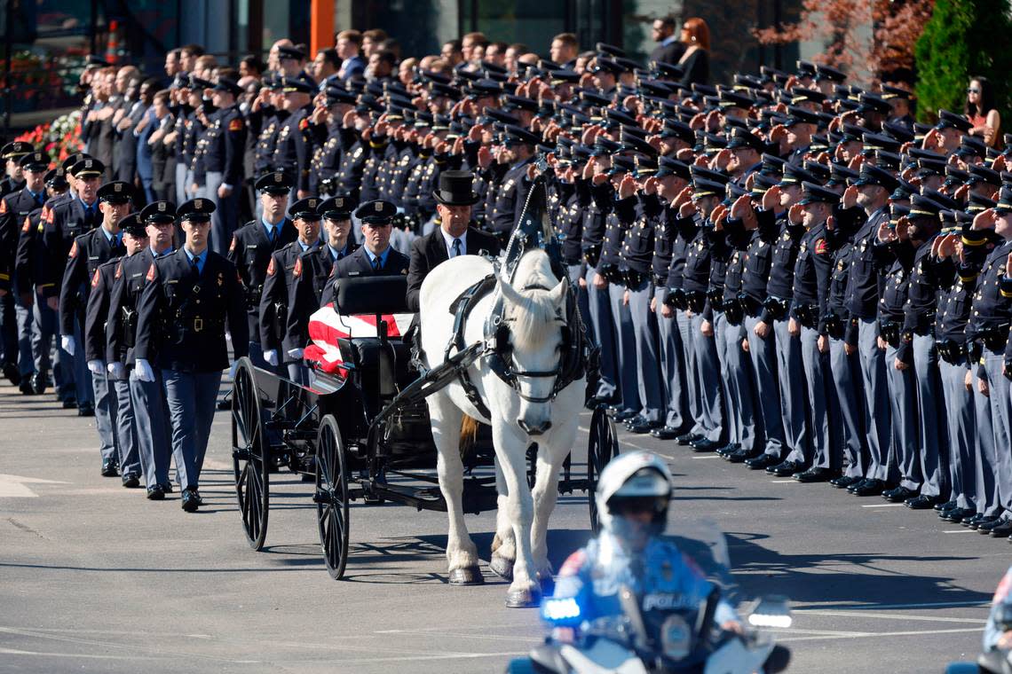 A funeral caisson transports the casket of Raleigh Police Officer Gabriel Torres to Cross Assembly Church in Raleigh, N.C. for his funeral Saturday, Oct. 22, 2022. Officer Torres was killed during a mass shooting Oct. 13.