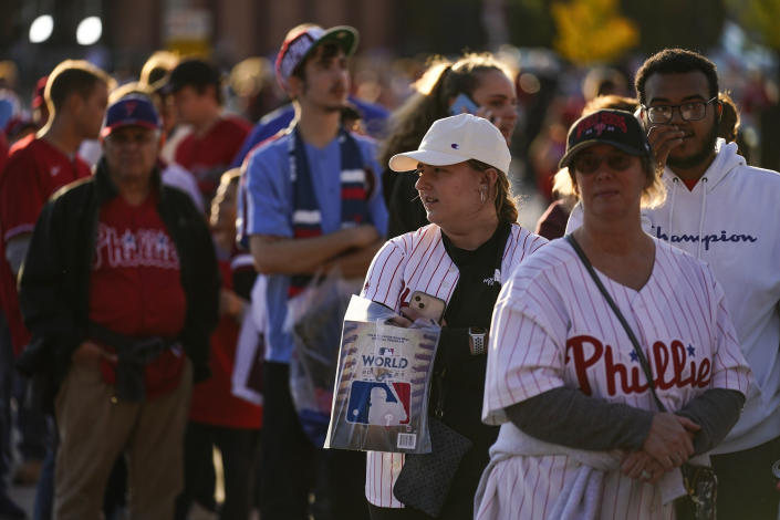Fans arrive for Game 3 of baseball's World Series between the Houston Astros and the Philadelphia Phillies on Tuesday, Nov. 1, 2022, in Philadelphia. (AP Photo/Matt Rourke)