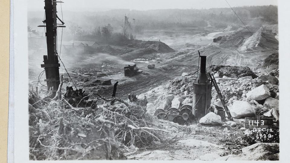 In December 1923, clearing land for Scituate Reservoir near the east end of the dam, which is now Scituate Avenue looking southwest.