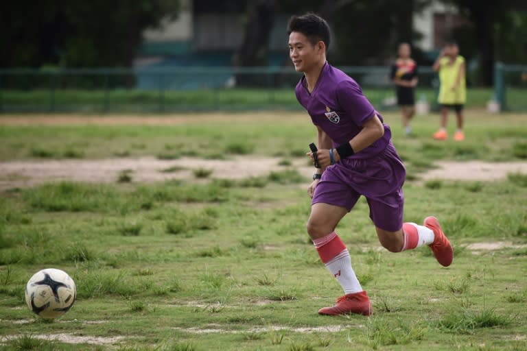 Ekkapol Chantawong, coach of Thailand's "Wild Boars" football team that was trapped for nearly three weeks in a cave in 2018, has been stranded again -- this time by flash floods after Typhoon Yagi (Lillian SUWANRUMPHA)