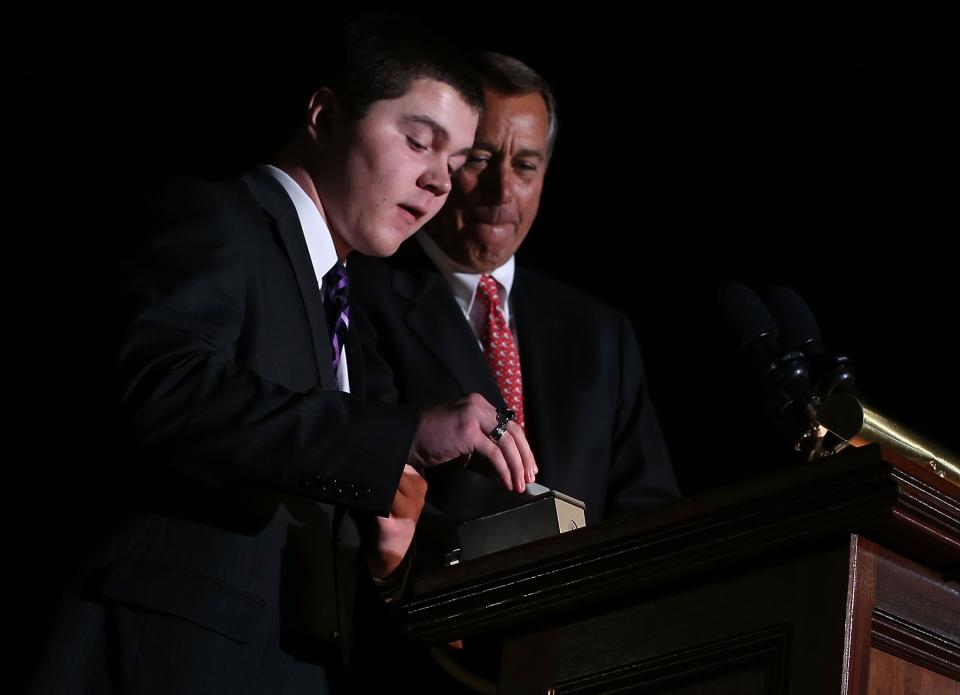 WASHINGTON, DC - DECEMBER 04: U.S. Speaker of the House Rep. John Boehner (R-OH) (R) lights up the 2012 Capitol Christmas Tree with Ryan Shuster (L), a senior at Discovery Canyon Campus in Colorado Spring, Colorado, December 4, 2012 at the West Front Lawn of the U.S. Capitol in Washington, DC. The year's tree is a 65-foot Engelmann spruce from the Blanco Ranger District of the White River National Forest in Colorado. (Photo by Alex Wong/Getty Images)