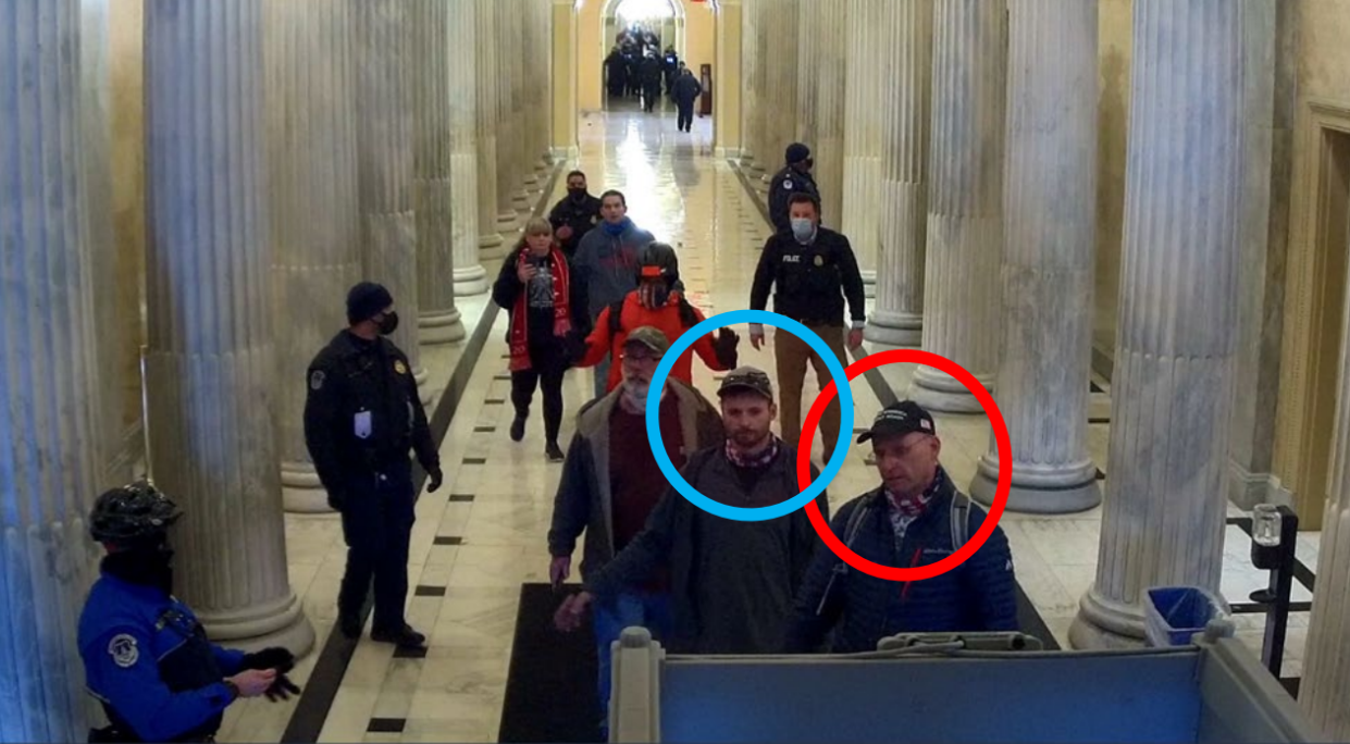 Daryl Johnson, right, and his son Daniel appear on a video screenshot from inside the U.S. Capitol during the Jan. 6 riot. Daryl Johnson has now been sentenced for multiple charges of invasion of privacy after pleading guilty to recording women in a tanning salon he operated.