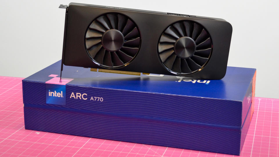 An Intel Arc A770 LE graphics card on a table with a pink desk mat