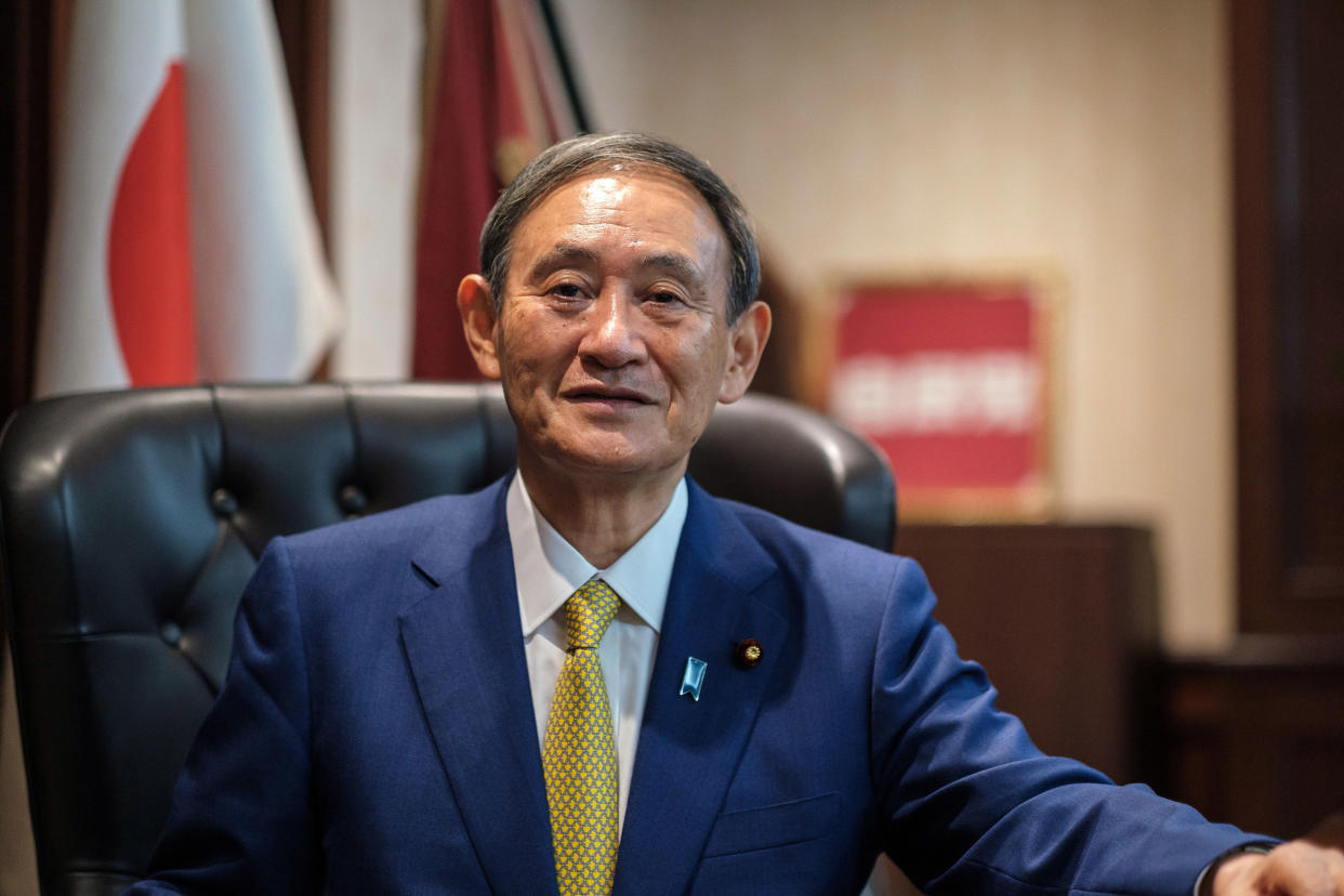 Image: Newly elected leader of Japan's Liberal Democratic Party (LDP) Yoshihide Suga poses for a portrait at his office following his press conference at the party's headquarters in Tokyo o (Nicolas Datiche / AFP via Getty Images file)