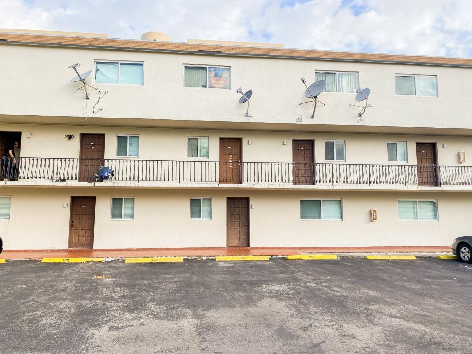 The exterior of a Miami apartment building in Little Havana on a cloudy day.