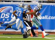 Dallas Cowboys wide receiver Dez Bryant (88) scores a touchdown against Detroit Lions strong safety Glover Quin (27) during 2nd half of a game at Ford Field. Lions won 31-30. Mandatory Credit: Mike Carter-USA TODAY Sports