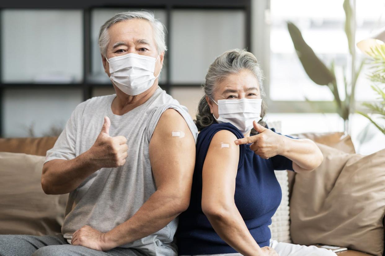 Even if you got a COVID-19 shot last fall, the spring shot is still essential for the 65 and up age group. <a href="https://www.gettyimages.com/detail/photo/old-asian-senior-couple-wearing-face-mask-virus-royalty-free-image/1332149015?phrase=covid-19+shots+and+seniors&adppopup=true" rel="nofollow noopener" target="_blank" data-ylk="slk:whyframestudio/iStock via Getty Images Plus;elm:context_link;itc:0;sec:content-canvas" class="link ">whyframestudio/iStock via Getty Images Plus</a>