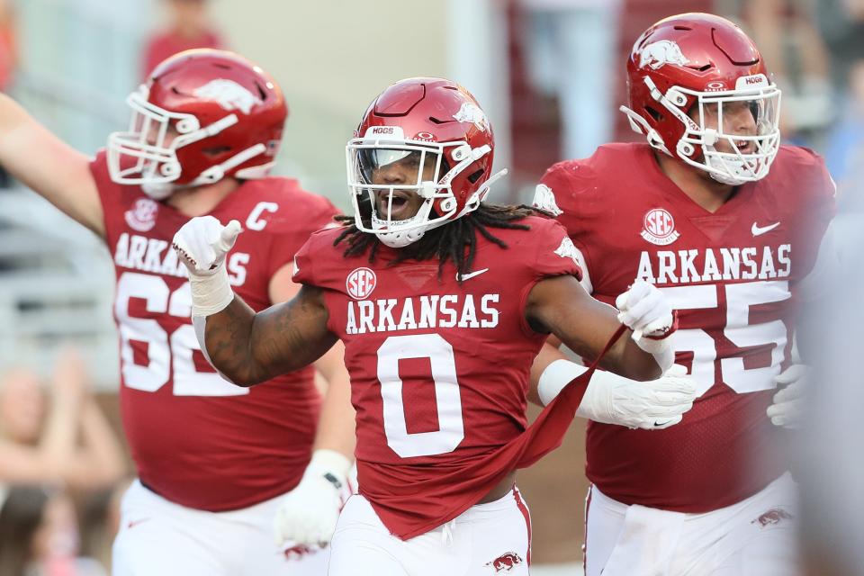 Sep 16, 2023; Fayetteville, Arkansas, USA; Arkansas Razorbacks running back AJ Green (0) celebrates after scoring a touchdown int he first quarter against the BYU Cougars at Donald W. Reynolds Razorback Stadium.