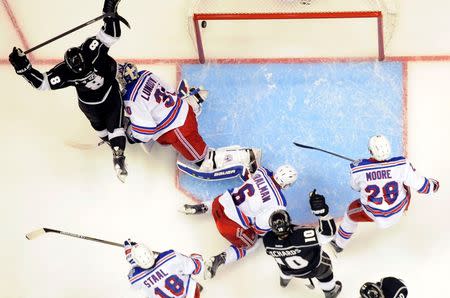 Jun 4, 2014; Los Angeles, CA, USA; Los Angeles Kings defenseman Drew Doughty (8) reacts after scoring a goal against New York Rangers goalie Henrik Lundqvist (30) during the first period in game one of the 2014 Stanley Cup Final at Staples Center. Mandatory Credit: Richard Mackson-USA TODAY Sports