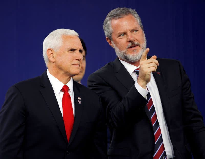 FILE PHOTO: Liberty University President Jerry Falwell Jr. and U.S. President Mike Pence at the school's commencement in Lynchburg, Virginia