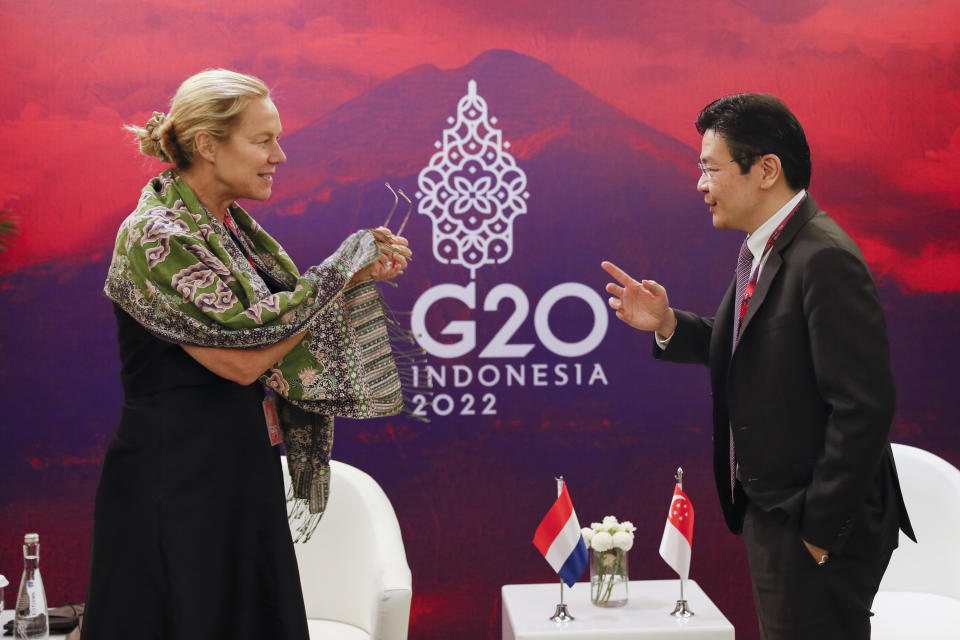 Singaporean Finance Minister Lawrence Wong, right, talks with Dutch Finance Minister Sigrid Kaag during their bilateral meeting on the sidelines of the G20 Finance Ministers and Central Bank Governors Meeting in Nusa Dua, Bali, Indonesia, Saturday, July 16, 2022. (Made Nagi/Pool photo via AP)