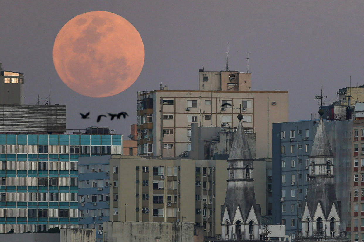 A view shows a full moon known as the 'Blue Moon' over de city of Porto Alegres, Rio Grande do Sul state, Brazil, August 30, 2023. REUTERS/Diego Vara