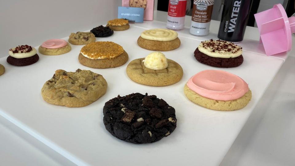 The cookies offered on opening day at Crumbl Cookies. From left to right: snickerdoodle, red velvet cupcake, fried ice cream, waffle, classic pink sugar, chocolate chip, chocolate cookies and cream.