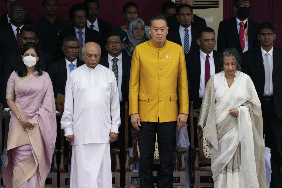 Thai Prime Minister Srettha Thavisin, second right, stands with Sri Lankan Prime Minister Dinesh Gunawaradane, second left, and the First Lady of Sri Lanka Maithree Wickremesinghe, right, as they observe a minute's silence in honor of Sri Lankan heroes during the 76th Independence Day commemoration ceremony of Sri Lanka in Colombo, Sri Lanka, Sunday, Feb. 4, 2024. (AP Photo/Eranga Jayawardena)