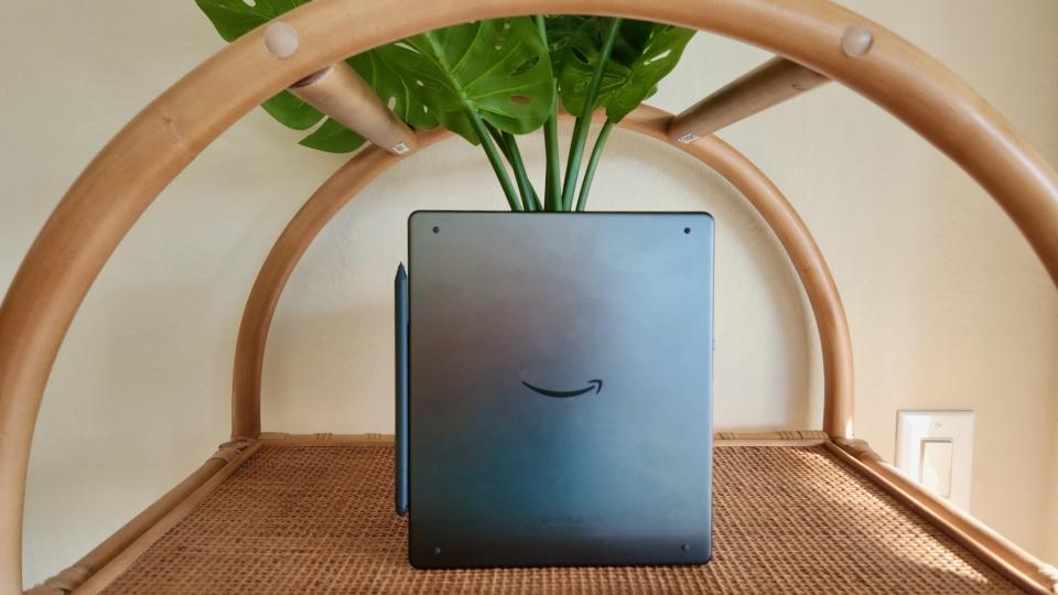  The Amazon Kindle Scribe sitting on a shelf. 