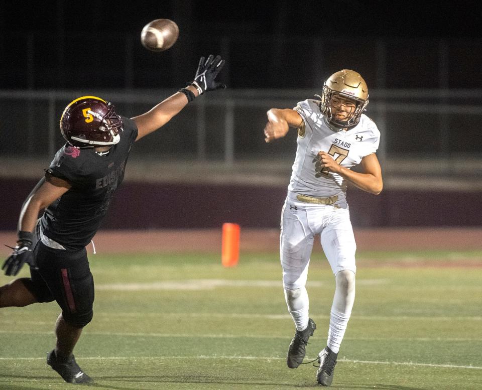 Stagg's Jerry Rigumidin (7), right, throws a pass under pressure from Edison's Javonnie Haymon (5) during a varsity football game against Stagg at Edison's Magnasco Stadium in Stockton on Friday, Sept. 16, 2022.