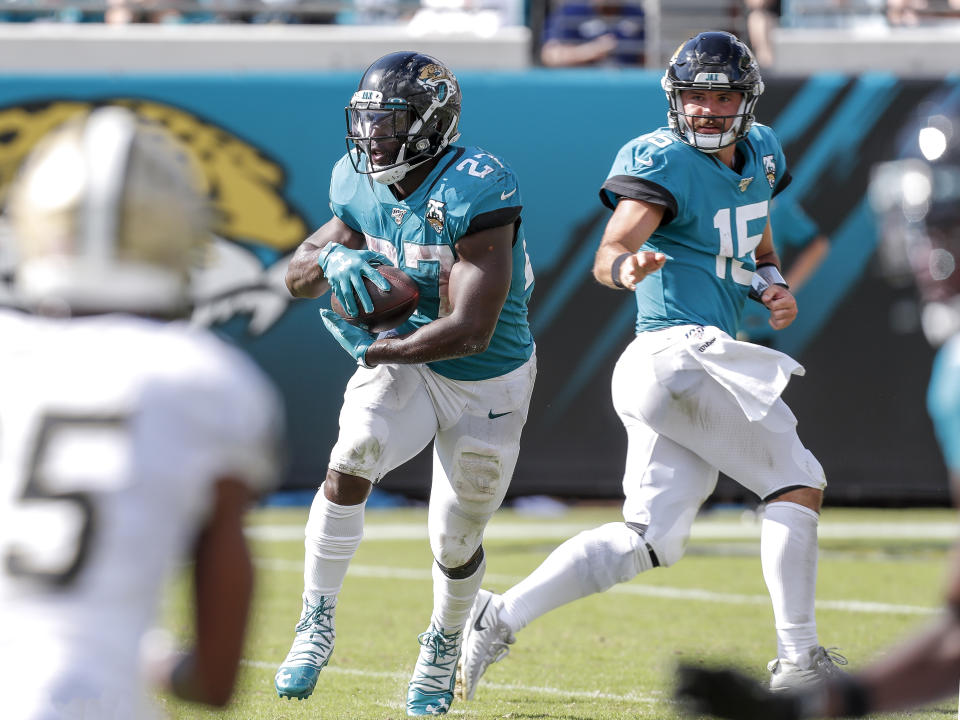 JACKSONVILLE, FL - OCTOBER 13: Quarterback Gardner Minshew II #15 of the Jacksonville Jaguars hands off to running back Leonard Fournette #27 against the New Orleans Saints at TIAA Bank Field on October 13, 2019 in Jacksonville, Florida. The Saints defeated the Jaguars 13-6. (Photo by Don Juan Moore/Getty Images)