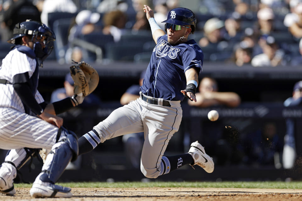 Tampa Bay Rays' Jonathan Aranda scores a run past New York Yankees catcher Kyle Higashioka during the eighth inning of a baseball game on Saturday, Sept. 10, 2022, in New York. (AP Photo/Adam Hunger)