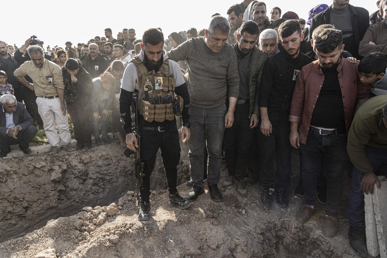 Syrian Kurds attend a funeral of people killed in Turkish airstrikes in the village of Al Malikiyah, northern Syria, November 21, 2022. / Credit: Baderkhan Ahmad/AP