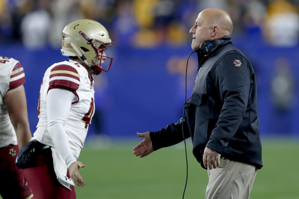 Boston College head coach Steve Addazio, right, greets long snapper Aidan Livingston, left, after the team made a field goal against Pittsburgh during the second half of an NCAA college football game, Saturday, Nov. 30, 2019, in Pittsburgh. (AP Photo/Keith Srakocic)