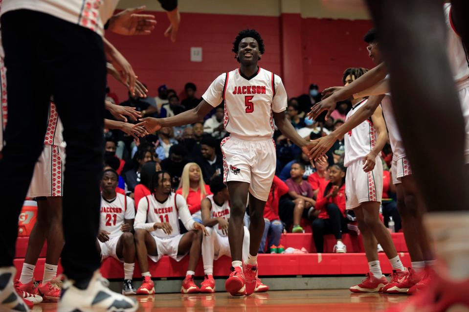 Jackson's TayVion Lawson (5) is introduced before the district tournament final against Ribault.