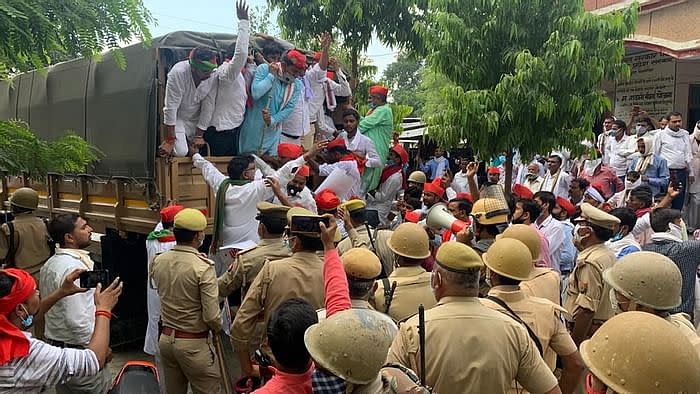 Police detain protesters in Jalaun.