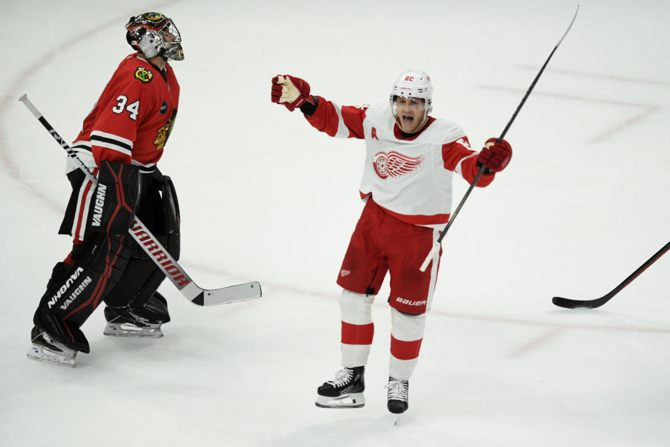 Detroit Red Wings' Patrick Kane (88) celebrates after scoring the winning goal against Chicago Blackhawks goalie Petr Mrazek (34) to win 3-2 in overtime in an NHL hockey game, Sunday, Feb. 25, 2024, in Chicago. (AP Photo/Paul Beaty)