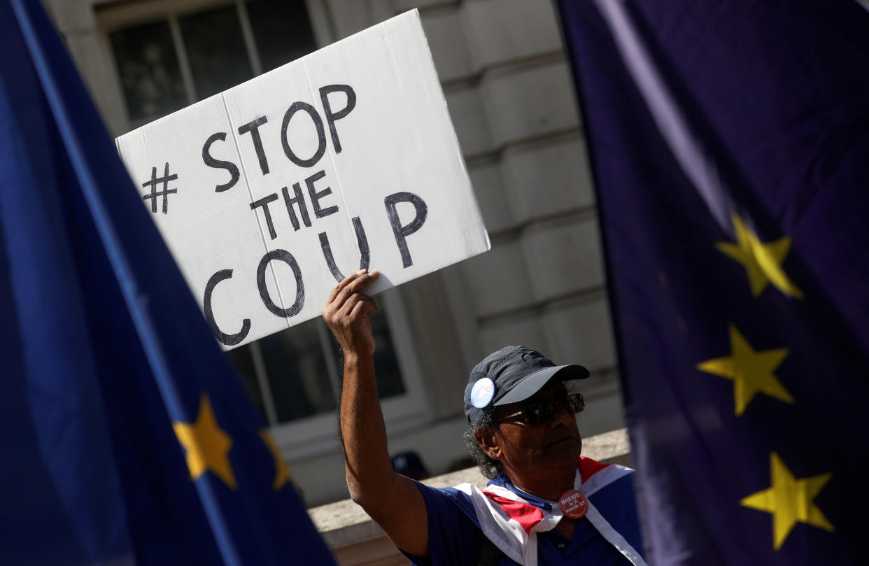 An anti-Brexit protester holds a placard as he demonstrates in Westminster in London, Britain August 29, 2019. REUTERS/Simon Dawson