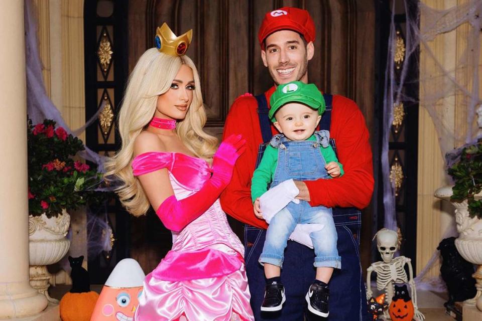 <p>Kevin Ostajewski </p> Paris Hilton and Carter Reum with son Phoenix as <em>Super Mario</em> characters