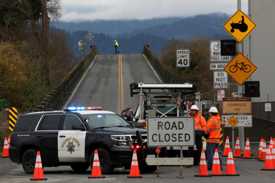 Officials block the Fernbridge in Ferndale, Calif., following an earthquake Tuesday, Dec. 20, 2022.