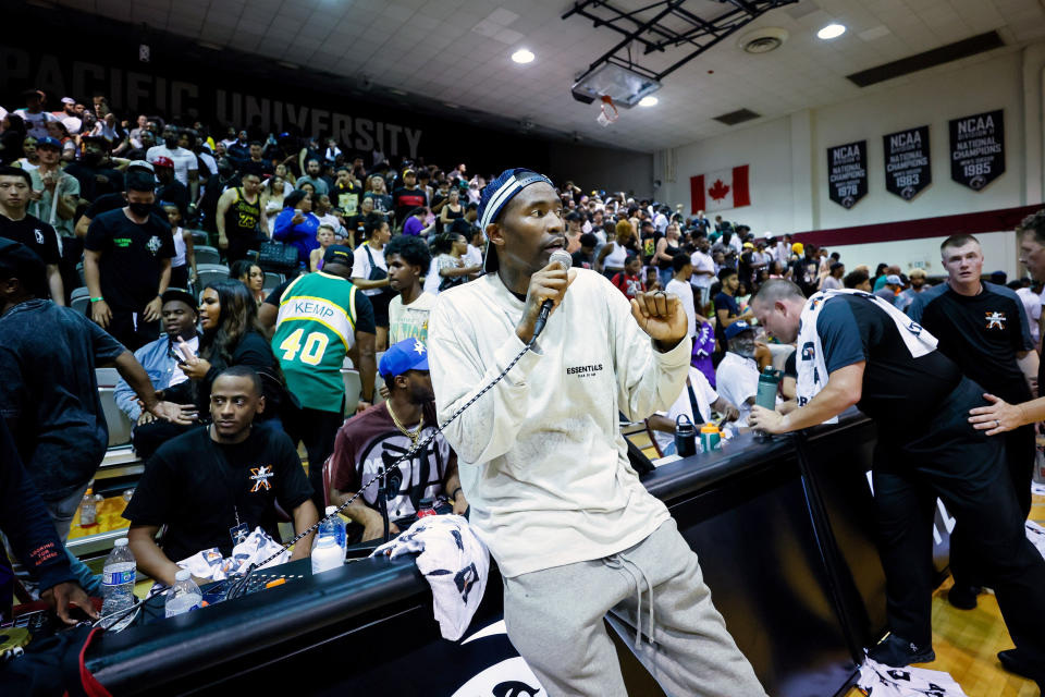 FILE - Jamal Crawford announces to the crowd that a basketball game is over in the second quarter due to unsafe playing conditions during his Seattle summer-league pro-am tournament Saturday, Aug. 20, 2022, in Seattle. Jamal Crawford is the ambassador of Seattle basketball, from his long NBA career to his continued pro-am league that brings in a stream of current NBA players every summer. While it may not seem like a benchmark moment, Crawford believes there is value even if it’s just an exhibition game that’s returning to Seattle. (Jennifer Buchanan/The Seattle Times via AP, File)