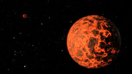 FILE PHOTO: An alien world just two-thirds the size of Earth - one of the smallest on record - detected by NASA's Spitzer Space Telescope is seen in this NASA artist's illustration released by NASA on July 18, 2012. NASA/JPL-Caltech/Handout via REUTERS/File Photo