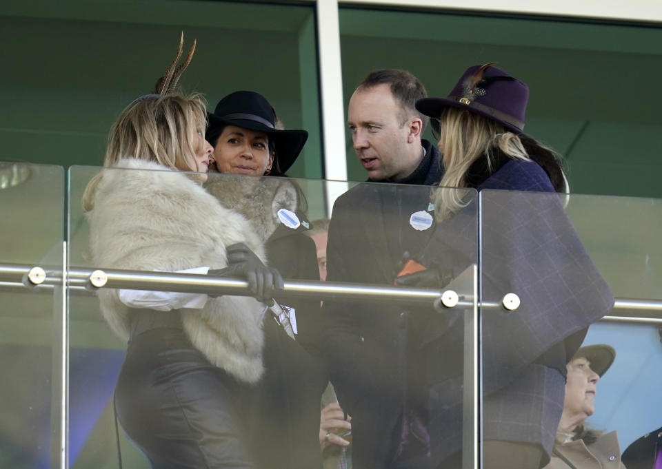 Carol Vorderman, Gina Coladangelo and Matt Hancock in the stands during the Close Brothers Mares' Hurdle on day one of the Cheltenham Festival at Cheltenham Racecourse. Picture date: Tuesday March 14, 2023. (Photo by Andrew Matthews/PA Images via Getty Images)