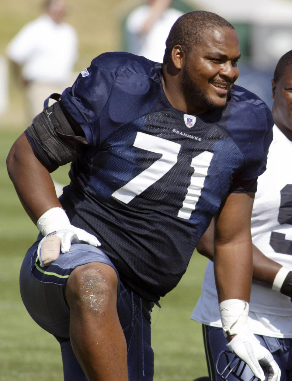 FILE - In this Aug. 15, 2006, file photo, Seattle Seahawks offensive tackle Walter Jones smiles along the sidelines during NFL football training camp at Eastern Washington University in Cheney, Wash. Jones was elected to the Pro Football Hall of Fame on Saturday, Feb. 1, 2014. (AP Photo/Jim Bryant, File)