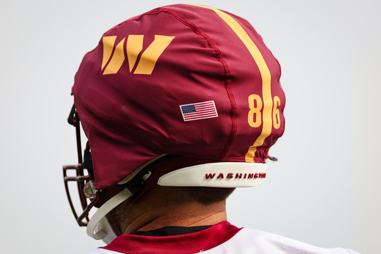 Zach Ertz of the Washington Commanders wears a Guardian Cap during training camp in July.