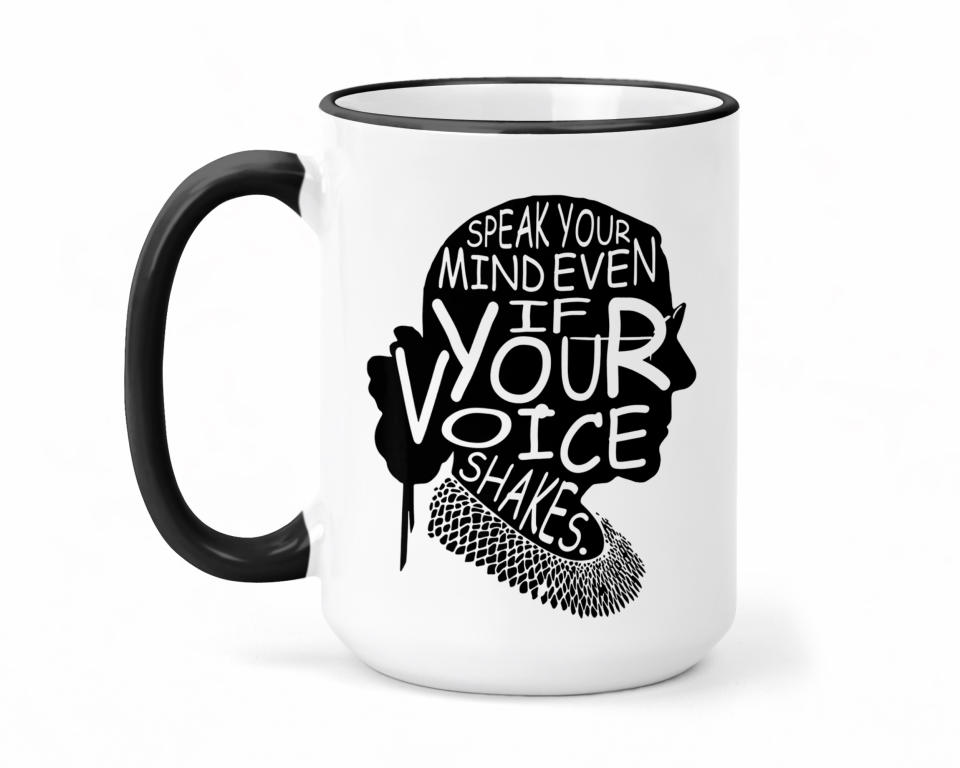 This product image shows a white ceramic mug with Ruth Bader Ginsburg in silhouette and the words: “Speak Your Mind Even if Your Voice Shakes.” It's printed on both sides for lefties and righties. (PettyBettyCo via AP)