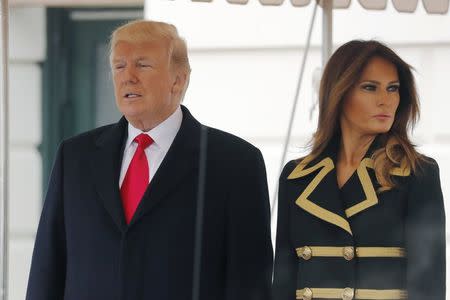 U.S. President Donald Trump and first lady Melania Trump wait to welcome Australian Prime Minister Malcolm Turnbull and Lucy Turnbull to the White House in Washington, U.S., February 23, 2018. REUTERS/Jonathan Ernst