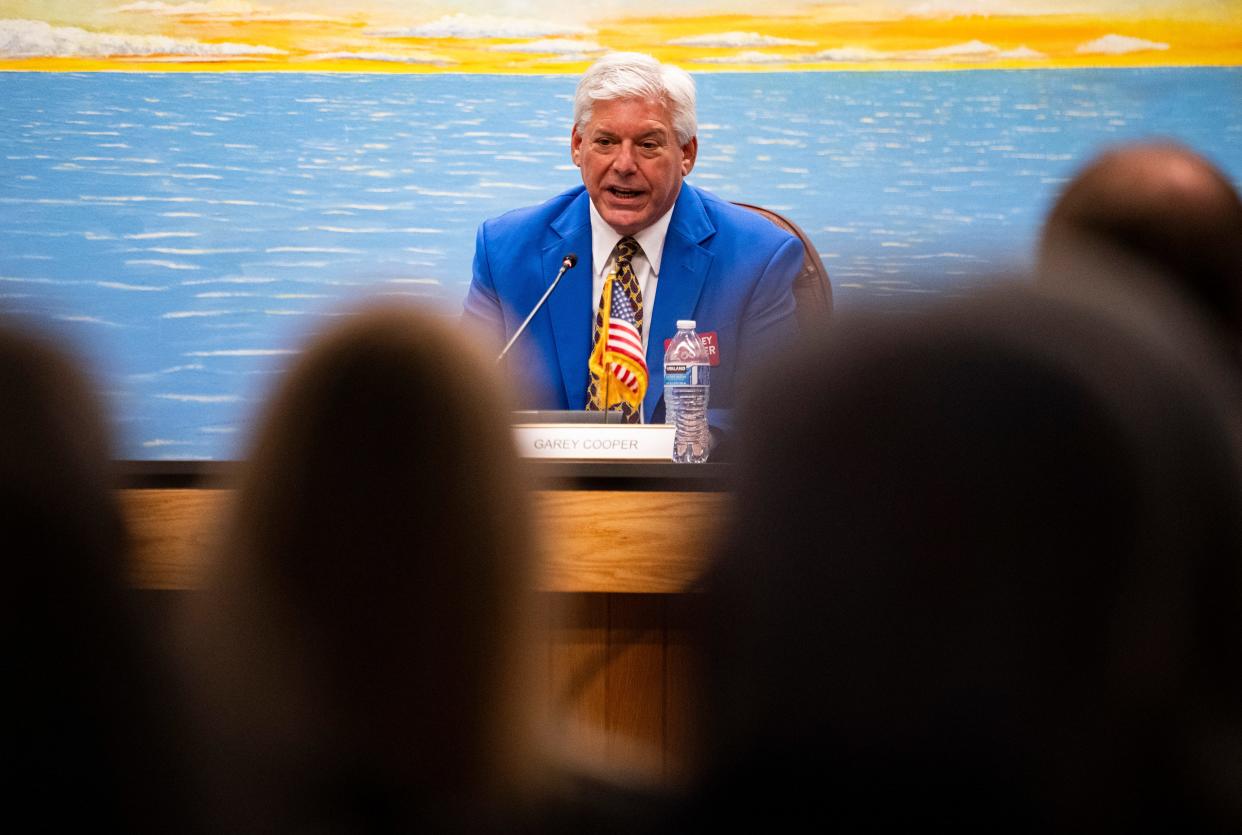 Garey Cooper answers a question during a candidate forum for the mayoral and city council elections at Naples City Hall chambers in Naples on Thursday, Feb. 1, 2024.