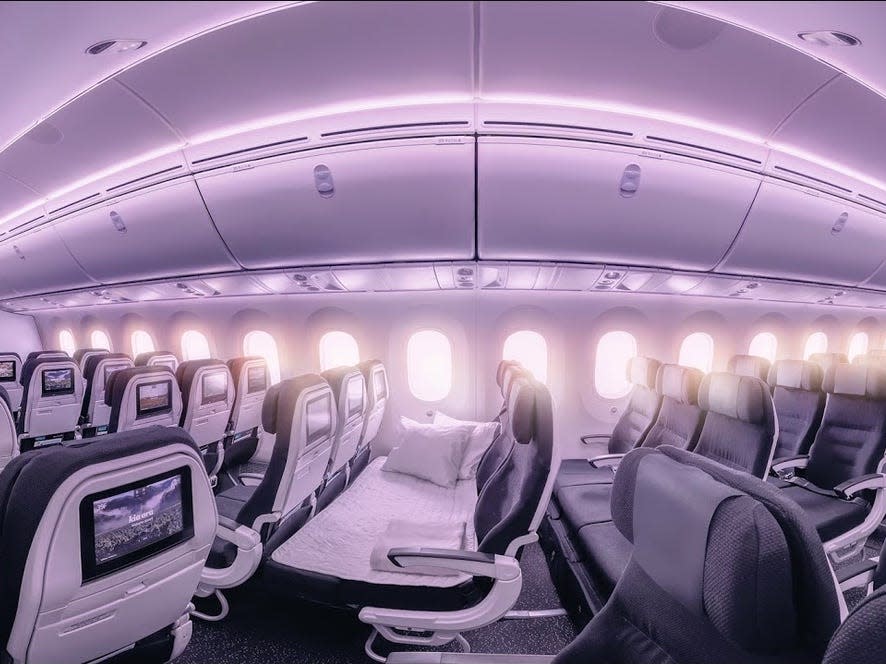 Lines of "Skycouches" in the cabin of a Air New Zealand aircraft.